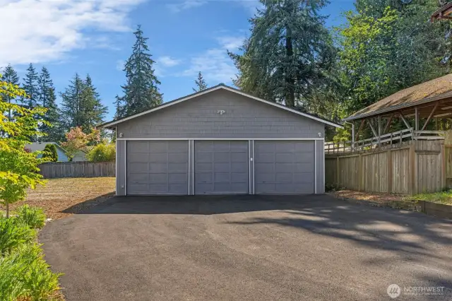 Dream shop for mechanics, hobbyists and so much more! All 3 bays have garage door openers.