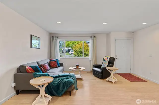 Bamboo tongue and groove floor throughout entire home. Living Room flooded with light from large front window.