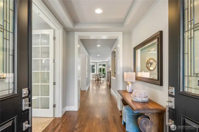 Grand foyer welcomes your guests inside. To the left is the main floor office/den.
