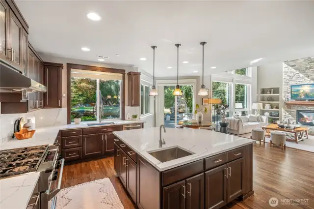 Open flow from kitchen to family room for seamless entertaining. Newly updated chef’s kitchen with white quartz slab counters.