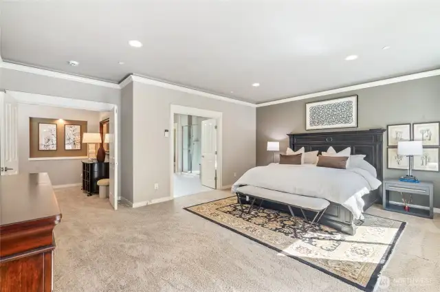 Upper-level primary suite offering privacy and luxury.