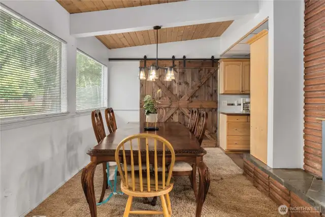 Formal dining room. The barn door on the back side of the room opens to a family room