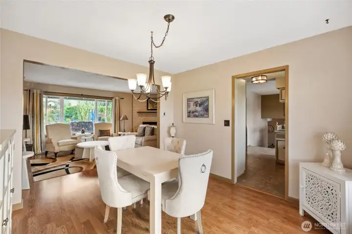 Dining facing the living room and kitchen