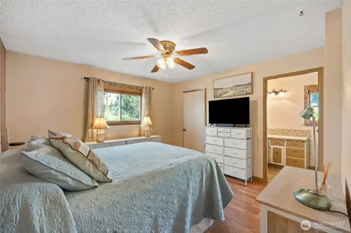 Primary suite with walk in closet and 3/4 bath