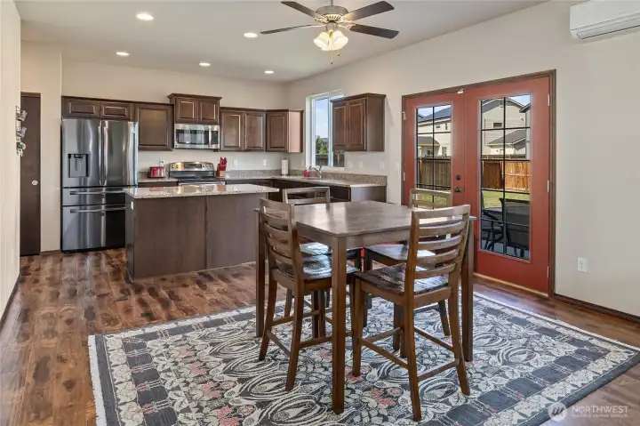 Space for a breakfast table sits perfectly between the kitchen and living room, and offers quick access to the patio.