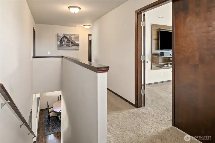 Four spacious bedrooms up here—primary suite with spa bath & walk-in closet, a large double-door  media/bedroom with TV center, plus two more bedrooms  sharing a nearby full bath. Room for everyone, everything,  and every activity.