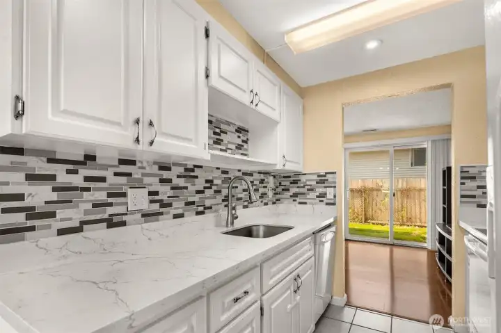 Stylish Tiled Backsplash w/Marble Counters
