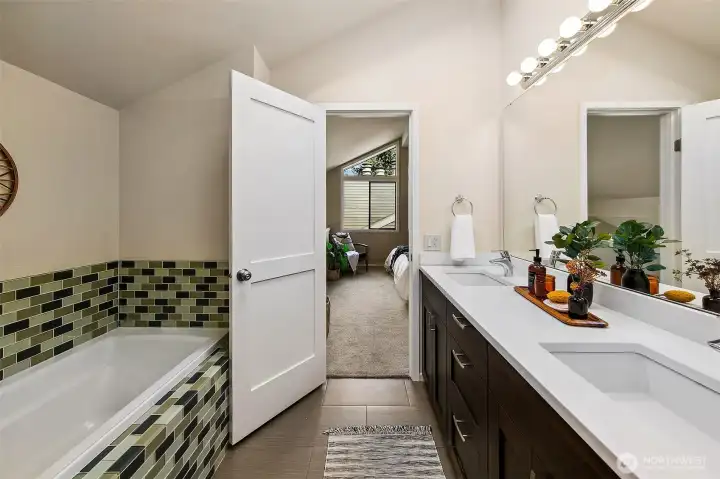 Primary bath upstairs.  *Photo is from when the condo was staged.