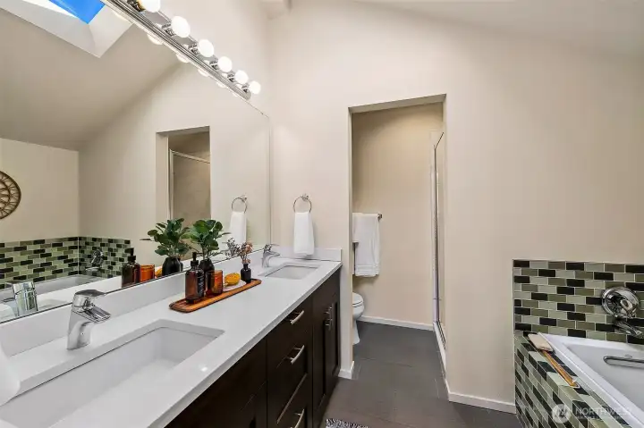 Primary bath upstairs, with separate toilet room.  *Photo is from when the condo was staged.