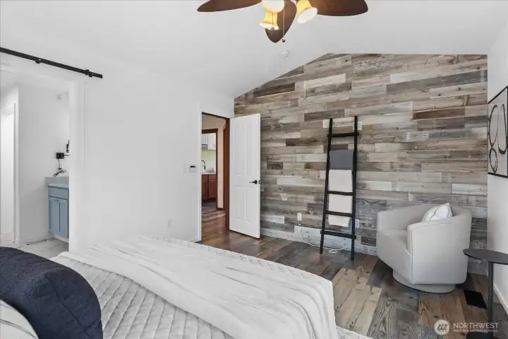 Shiplap wall in primary adds charm and warmth.