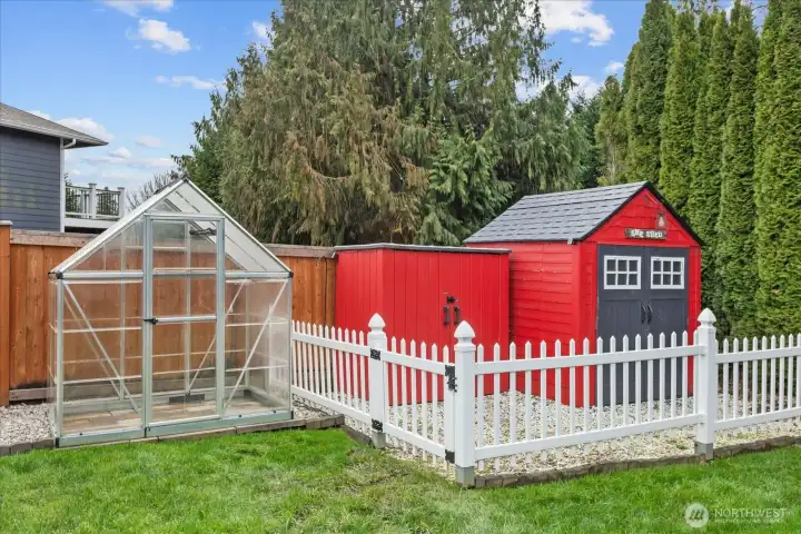 Storage buildings and greenhouse.