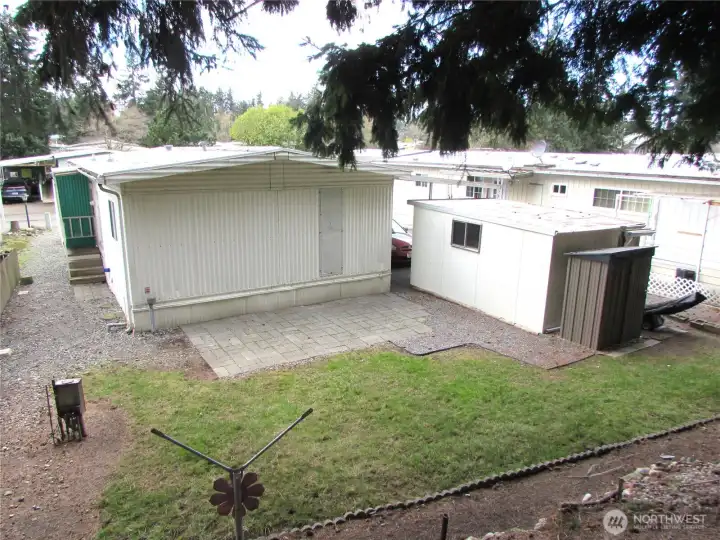 TWO SHEDS AND LAWNMOWER STAYS.