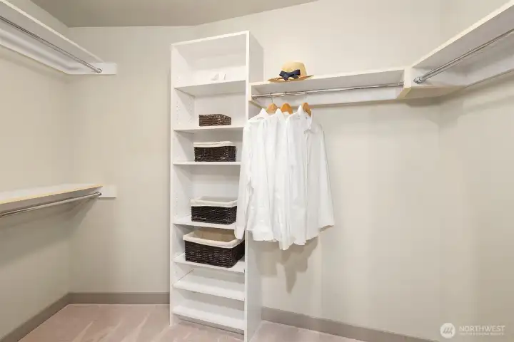 Walk-in closet with built-in organizers for all of your favorite things.