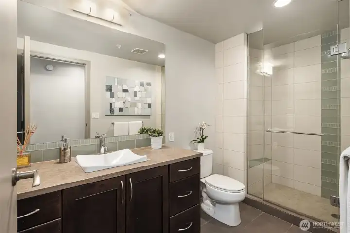 Guest bath with shower off the hallway.