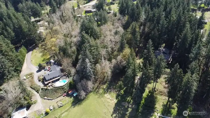 Aerial view of property with the valley located at the front of the photo (from north to south)