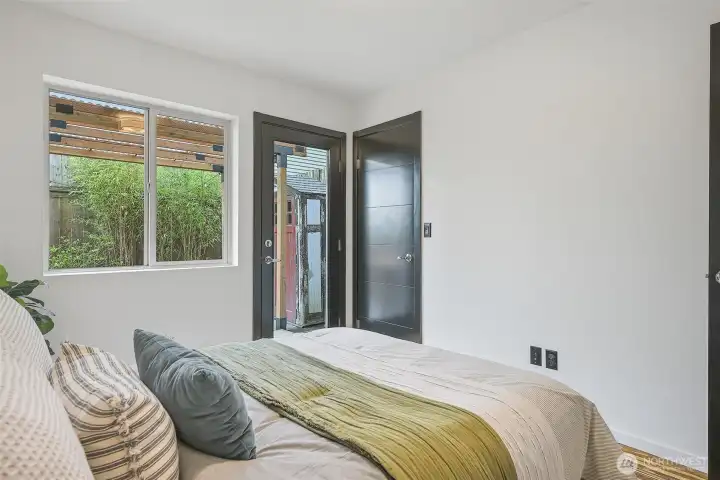 The lower level bedroom is bright and spacious, with direct access to your private covered patio. The closet has tons of extra room for storage and also houses the on-demand water heater, hot showers for hours!