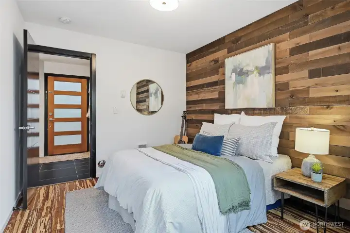 Unique wood-paneled walls and rich floors give the space a comfortable yet stylish vibe.