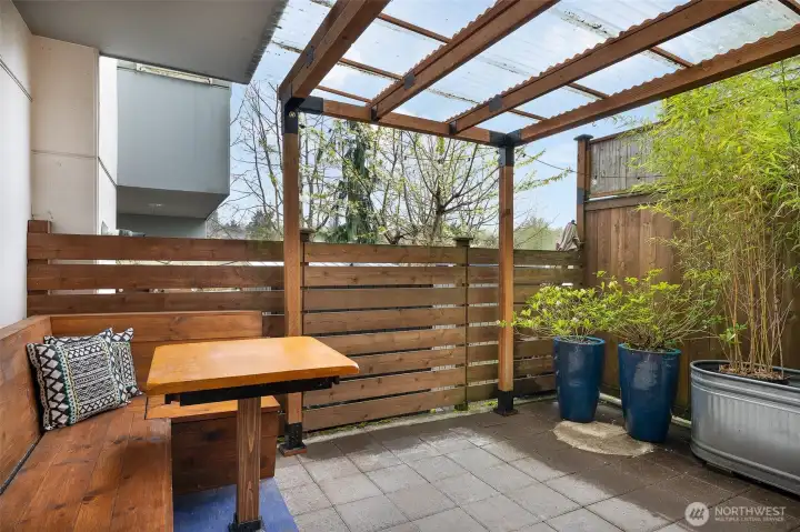 This sweet private patio is a great spot to relax with coffee or friends, and stays comfortably shaded and cool in the summer! Both benches lift up for great protected storage areas.