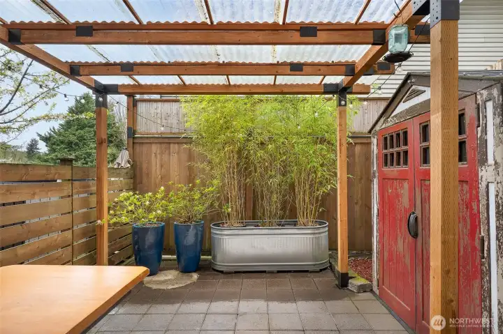 Truly a usable space year-round complete w/ a shed & handy built-in storage bench for all your gear. All pots and containers with lush vegetation stay with the home.