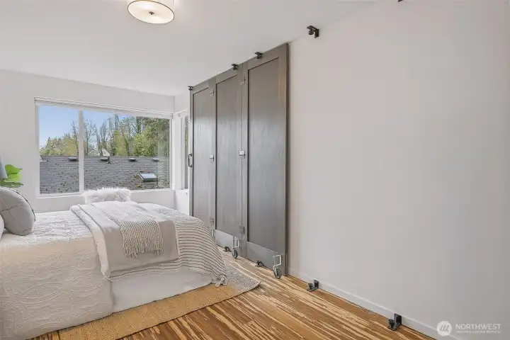 Primary bedroom slider barn door closes for privacy from the rest of the home.