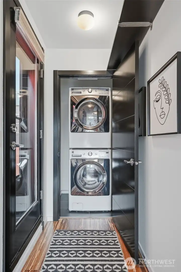 Convenient upper level laundry is tucked away out of sight.