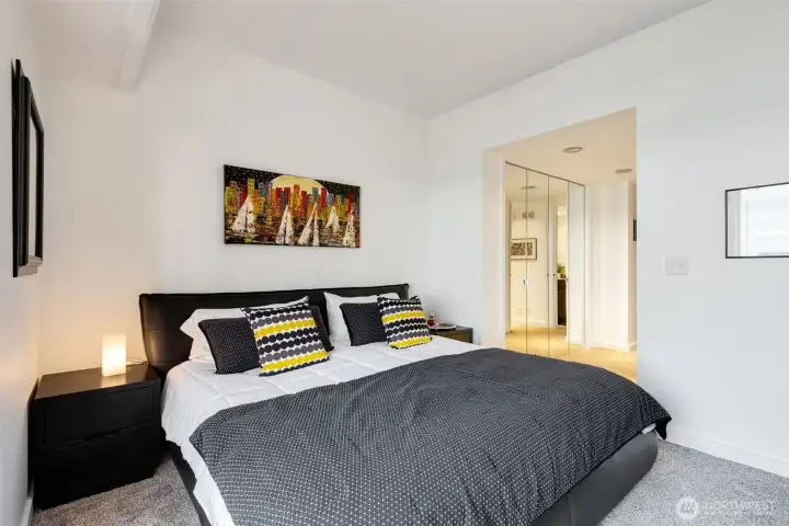 Bedroom comfortably accommodates a king-size bed and large dressers.