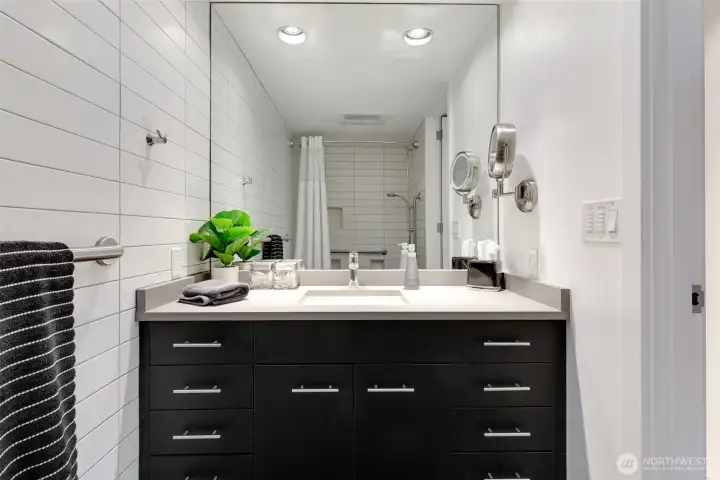 Modern bath with sleek vanity, contemporary fixtures, and clean tile finishes.