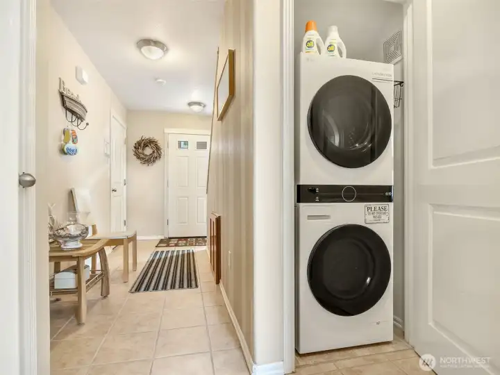 full size stackable washer and dryer on the main floor.