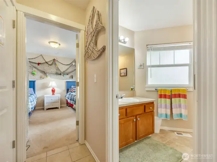 Full bathroom downstairs with laundry, storage and two bedooms.