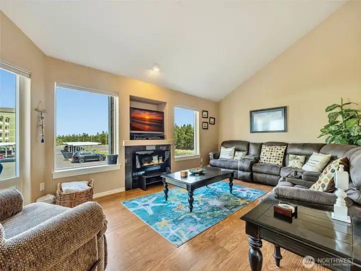 Upstairs living with large windows overlooking the dunes and the beach.