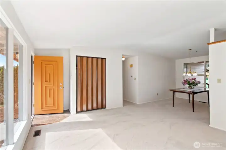 front door and closet from north side of living room