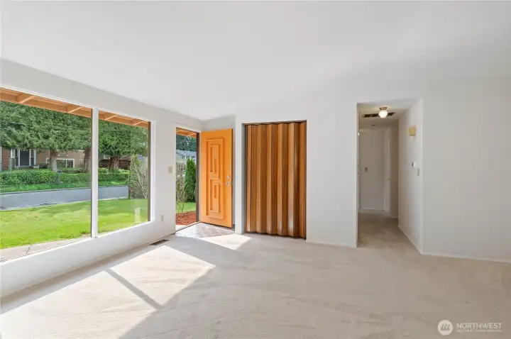 east windows, door, front closet and hall to bedrooms