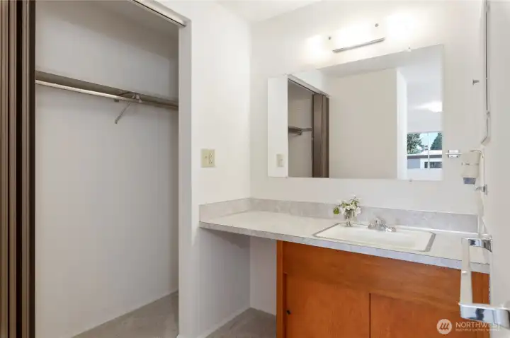 primary dressing area and send of two closets