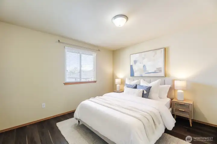 ATTRACTIVE SECOND BEDROOM UPSTAIRS IS PERFECT FOR GUESTS AND FRIENDS.