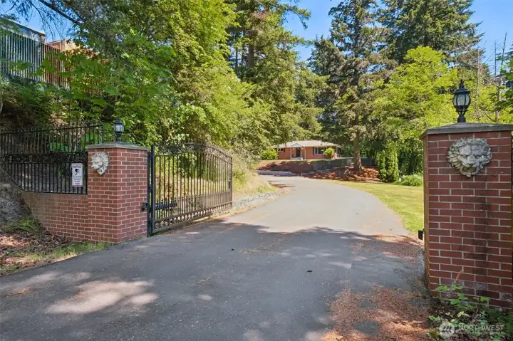 Private Gate and Entry to 4 bed 2.25 bath home with a bit more than 3 acres total and 3 parcels.