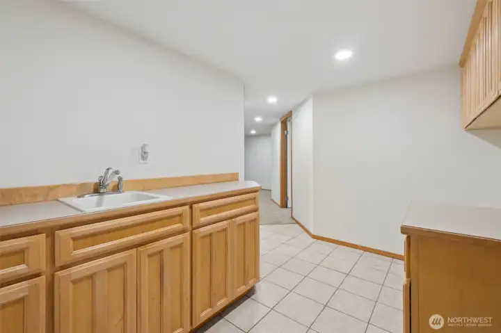 Laundry room (downstairs) and access to attached 1 car garage