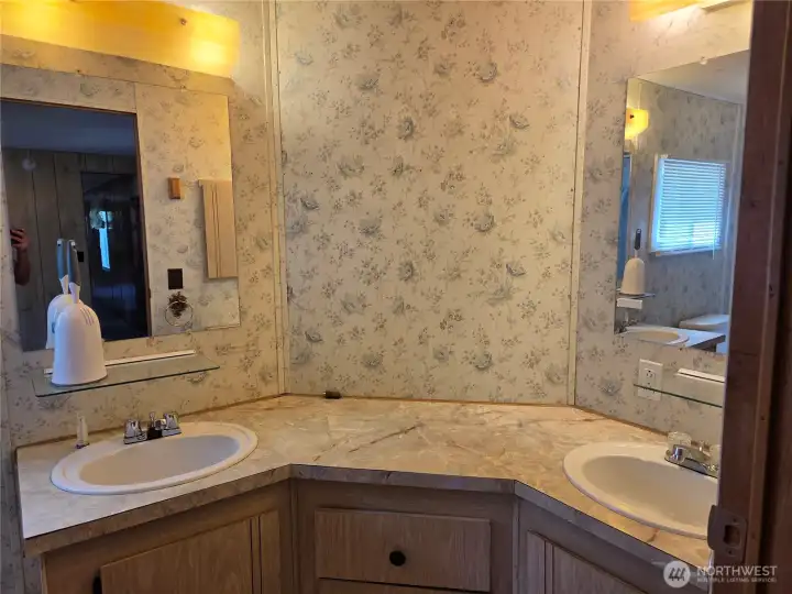 Primary bathroom with split double vanity