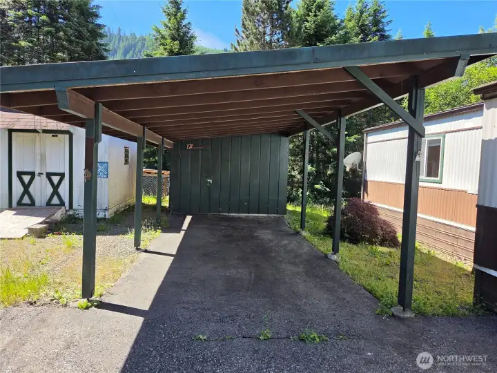 Single car carport with attached storage shed