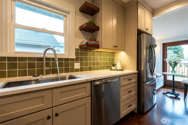 Full-height backsplash- really nice to have a window over the sink! And the under-cabinet lights create a perfect atmosphere.