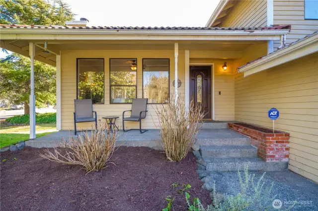 Covered front porch overlooks the park