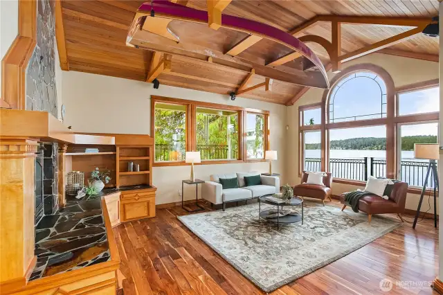Living Room with custom built in drawers, hearth of slate, wineweery canoe looking out to the water at Rich Pass
