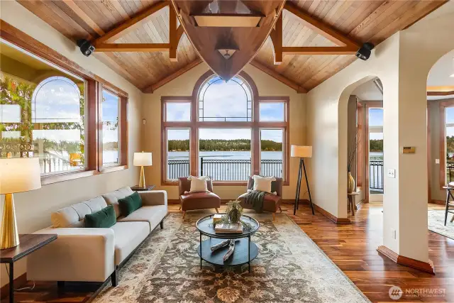Living Room with dining on right double doors to the wrap deck.