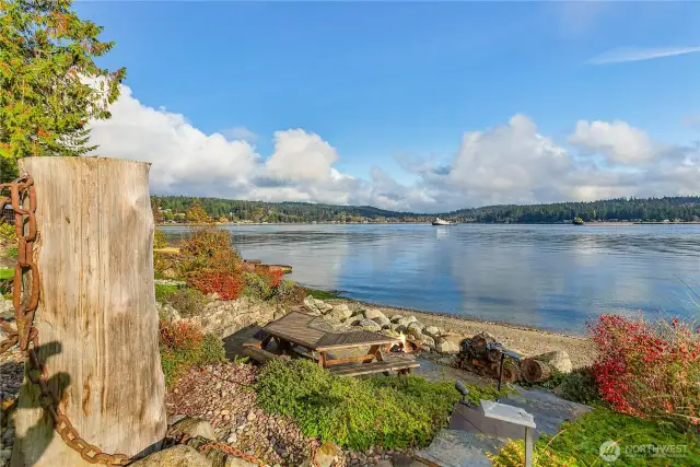 Fire pit with specially made table and benches to enjoy the ever changing waterfront