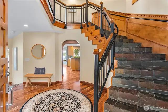 he entry has slate stairs and wood railing from the old Queen Ann School in Seattle. The custom woodwork and railing has unbelievable detail.