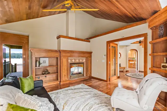 Den with a door to the exterior main deck, see through fireplace, and double doors to the entry. This could be a Primary Bedroom if you wanted main floor primary