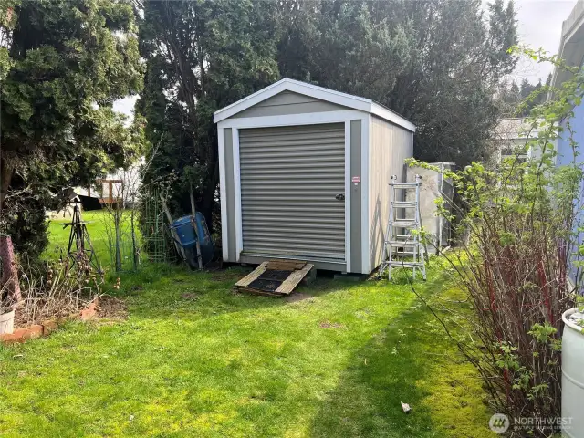 Huge storage shed with garage door.