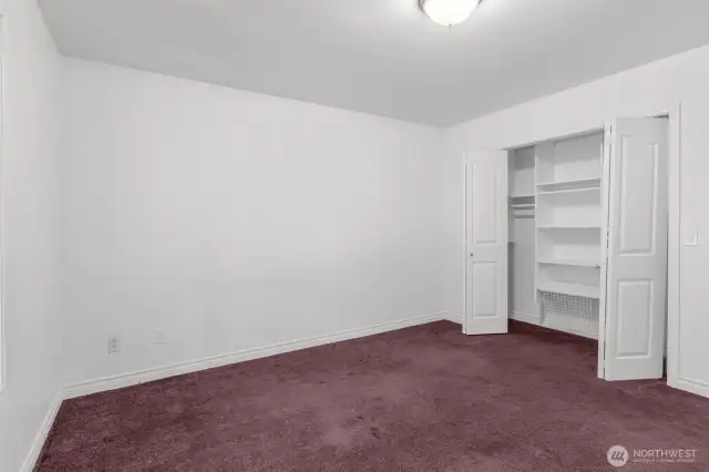 One of two guest bedrooms with custom closet organizer.