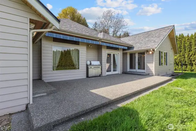 Patio with custom awnings and access from family room, living room and primary bedroom.
