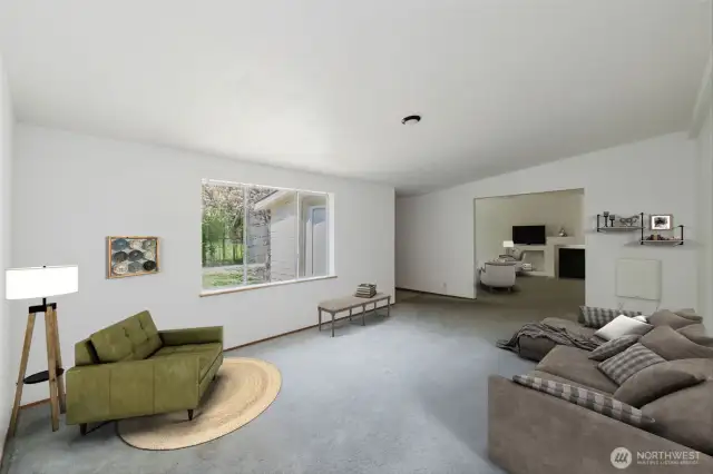 Upon entry, you're welcomed by a spacious and bright living room, anchored by a large picture window a large picture window that frames the beauty of the outdoors and fills the inviting space with natural light. This room has been virtually staged.
