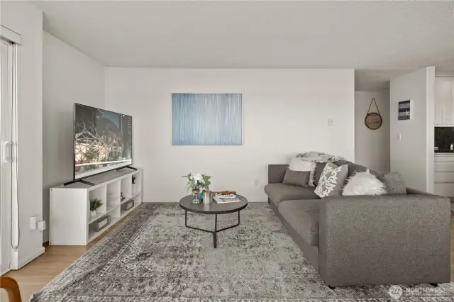 Enjoy the floor to ceiling windows and views over the lake and Olympic mountains from the living room!